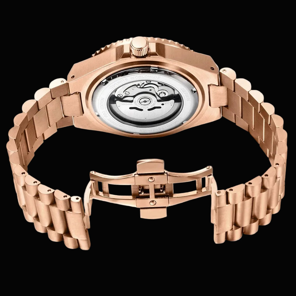 Rose gold automatic watch with a metal link bracelet, shown from the back to reveal the transparent case and mechanical movement, with the clasp detached below on a white background.