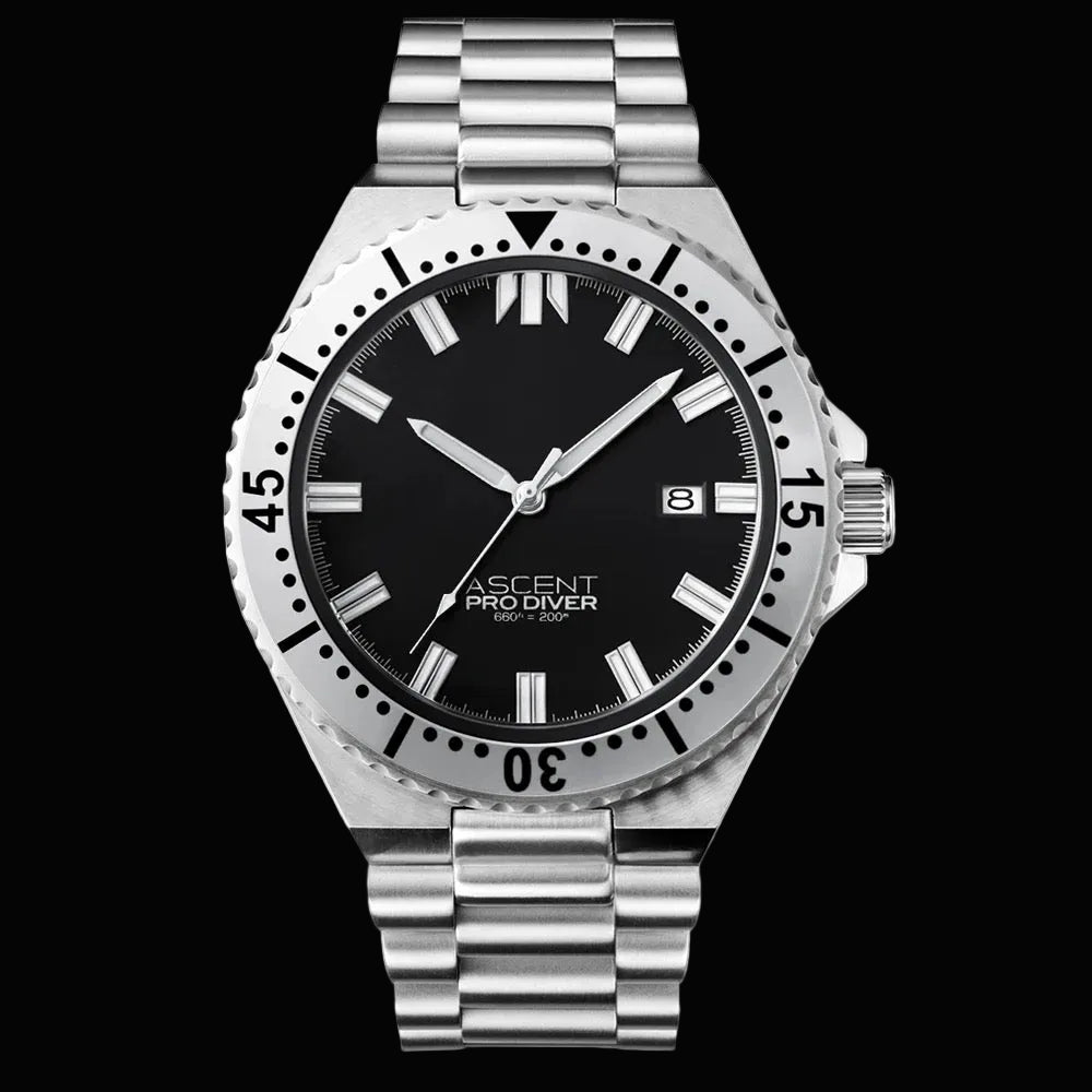 A stainless steel wristwatch with a black dial, black bezel, and silver metal bracelet. The dial features silver-tone hour markers and hands, a date window at 3 o'clock, and the brand name 'ASCENT PRO DIVER' printed on the dial.